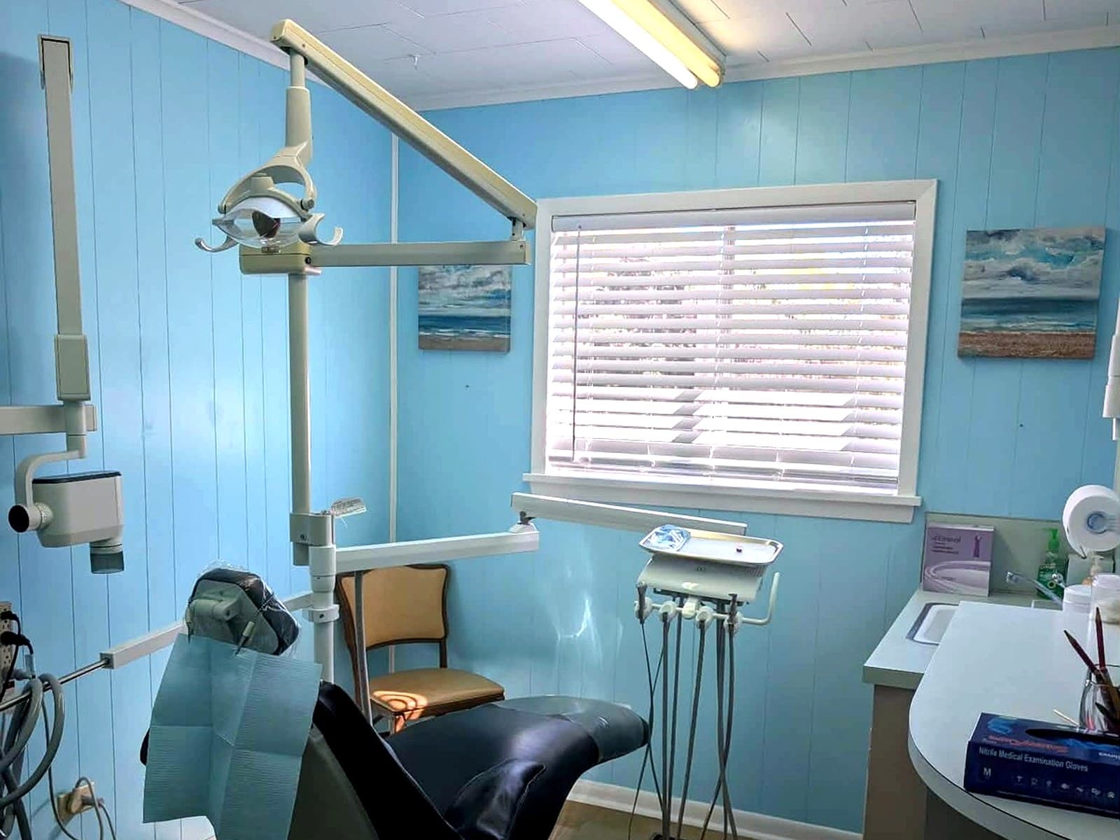 Treatment room with ocean artwork